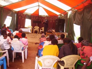 PASTOR TOM PREACHING AT THE END YEAR CHURCH CELEBRATION